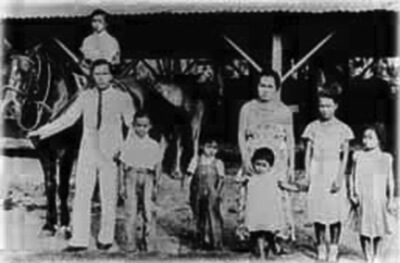 Labrador family at Stable Camp, Koloa, ca. 1935. Andres Labrador was responsible for the care of horses and mules used on the plantation. (Photo courtesy Andres Labrador.)